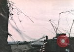 Image of US soldier assists wounded tank driver Iwo Jima Iwo Jima, 1945, second 58 stock footage video 65675057724