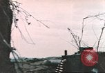 Image of US soldier assists wounded tank driver Iwo Jima Iwo Jima, 1945, second 59 stock footage video 65675057724