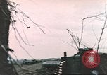 Image of US soldier assists wounded tank driver Iwo Jima Iwo Jima, 1945, second 62 stock footage video 65675057724