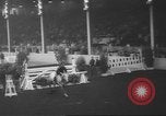 Image of horse jumping show Canada, 1960, second 23 stock footage video 65675057783