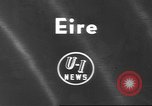 Image of funeral procession Ireland, 1960, second 1 stock footage video 65675057788