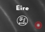 Image of funeral procession Ireland, 1960, second 3 stock footage video 65675057788