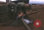Image of Marines refueling UH-1E Iroquois helicopters Khe Sanh Vietnam, 1968, second 18 stock footage video 65675058028