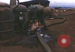 Image of Marines refueling UH-1E Iroquois helicopters Khe Sanh Vietnam, 1968, second 19 stock footage video 65675058028