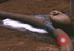 Image of Marines refueling UH-1E Iroquois helicopters Khe Sanh Vietnam, 1968, second 32 stock footage video 65675058028