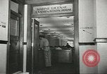 Image of Coast Guard screens prospective Merchant Marine seamen United States USA, 1944, second 52 stock footage video 65675058114