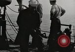 Image of planes dive bombing beach Pacific Theater, 1943, second 3 stock footage video 65675058376