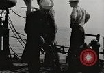 Image of planes dive bombing beach Pacific Theater, 1943, second 4 stock footage video 65675058376
