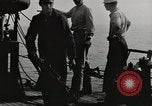 Image of planes dive bombing beach Pacific Theater, 1943, second 8 stock footage video 65675058376