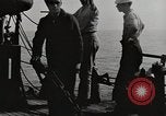 Image of planes dive bombing beach Pacific Theater, 1943, second 9 stock footage video 65675058376