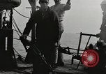 Image of planes dive bombing beach Pacific Theater, 1943, second 12 stock footage video 65675058376