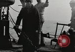 Image of planes dive bombing beach Pacific Theater, 1943, second 13 stock footage video 65675058376