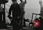 Image of planes dive bombing beach Pacific Theater, 1943, second 14 stock footage video 65675058376