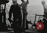 Image of planes dive bombing beach Pacific Theater, 1943, second 16 stock footage video 65675058376