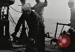 Image of planes dive bombing beach Pacific Theater, 1943, second 18 stock footage video 65675058376