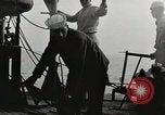 Image of planes dive bombing beach Pacific Theater, 1943, second 20 stock footage video 65675058376