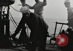 Image of planes dive bombing beach Pacific Theater, 1943, second 21 stock footage video 65675058376