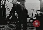 Image of planes dive bombing beach Pacific Theater, 1943, second 22 stock footage video 65675058376