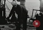 Image of planes dive bombing beach Pacific Theater, 1943, second 23 stock footage video 65675058376