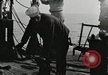 Image of planes dive bombing beach Pacific Theater, 1943, second 24 stock footage video 65675058376