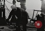 Image of planes dive bombing beach Pacific Theater, 1943, second 25 stock footage video 65675058376