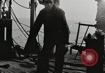 Image of planes dive bombing beach Pacific Theater, 1943, second 26 stock footage video 65675058376