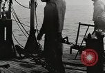Image of planes dive bombing beach Pacific Theater, 1943, second 28 stock footage video 65675058376
