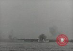 Image of planes dive bombing beach Pacific Theater, 1943, second 30 stock footage video 65675058376