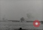 Image of planes dive bombing beach Pacific Theater, 1943, second 32 stock footage video 65675058376