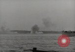 Image of planes dive bombing beach Pacific Theater, 1943, second 33 stock footage video 65675058376