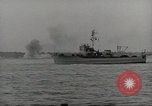 Image of planes dive bombing beach Pacific Theater, 1943, second 36 stock footage video 65675058376