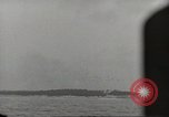 Image of planes dive bombing beach Pacific Theater, 1943, second 53 stock footage video 65675058376