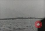 Image of planes dive bombing beach Pacific Theater, 1943, second 55 stock footage video 65675058376