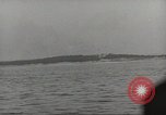 Image of planes dive bombing beach Pacific Theater, 1943, second 56 stock footage video 65675058376