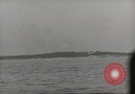 Image of planes dive bombing beach Pacific Theater, 1943, second 57 stock footage video 65675058376