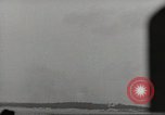Image of planes dive bombing beach Pacific Theater, 1943, second 59 stock footage video 65675058376
