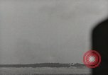 Image of planes dive bombing beach Pacific Theater, 1943, second 60 stock footage video 65675058376
