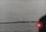 Image of planes dive bombing beach Pacific Theater, 1943, second 61 stock footage video 65675058376