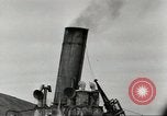 Immagine di Danni da bombardamento giapponese di Harbor olandese Aleutian Islands Alaska USA, 1942, secondo 34 filmato di repertorio 65675058382