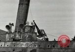 Immagine di Danni da bombardamento giapponese di Harbor olandese Aleutian Islands Alaska USA, 1942, secondo 36 filmato di repertorio 65675058382