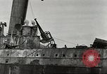Immagine di Danni da bombardamento giapponese di Harbor olandese Aleutian Islands Alaska USA, 1942, secondo 37 filmato di repertorio 65675058382