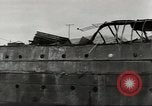 Immagine di Danni da bombardamento giapponese di Harbor olandese Aleutian Islands Alaska USA, 1942, secondo 41 filmato di repertorio 65675058382