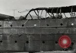 Immagine di Danni da bombardamento giapponese di Harbor olandese Aleutian Islands Alaska USA, 1942, secondo 42 filmato di repertorio 65675058382