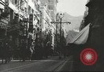 Immagine di Le forze giapponesi sfilano su Queens Road a Hong Kong Hong Kong, 1941, secondo 57 filmato di repertorio 65675058392