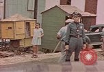 Standbild Mädchen auf windiger Tag mit Puerto Rican Kapitolhaube im Hintergrund Puerto Rico, 1941, aus Sekunde 12 historischem Filmmaterial Videoclip 65675058642