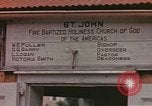 Standbild Mädchen auf windiger Tag mit Puerto Rican Kapitolhaube im Hintergrund Puerto Rico, 1941, aus Sekunde 38 historischem Filmmaterial Videoclip 65675058642