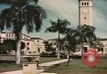Standbild Mädchen auf windiger Tag mit Puerto Rican Kapitolhaube im Hintergrund Puerto Rico, 1941, aus Sekunde 57 historischem Filmmaterial Videoclip 65675058642