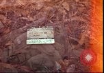 Image of thatched roof hut Pleiku South Vietnam, 1966, second 1 stock footage video 65675058783
