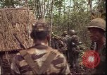 Image of thatched roof hut Pleiku South Vietnam, 1966, second 6 stock footage video 65675058783