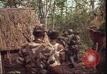 Image of thatched roof hut Pleiku South Vietnam, 1966, second 7 stock footage video 65675058783